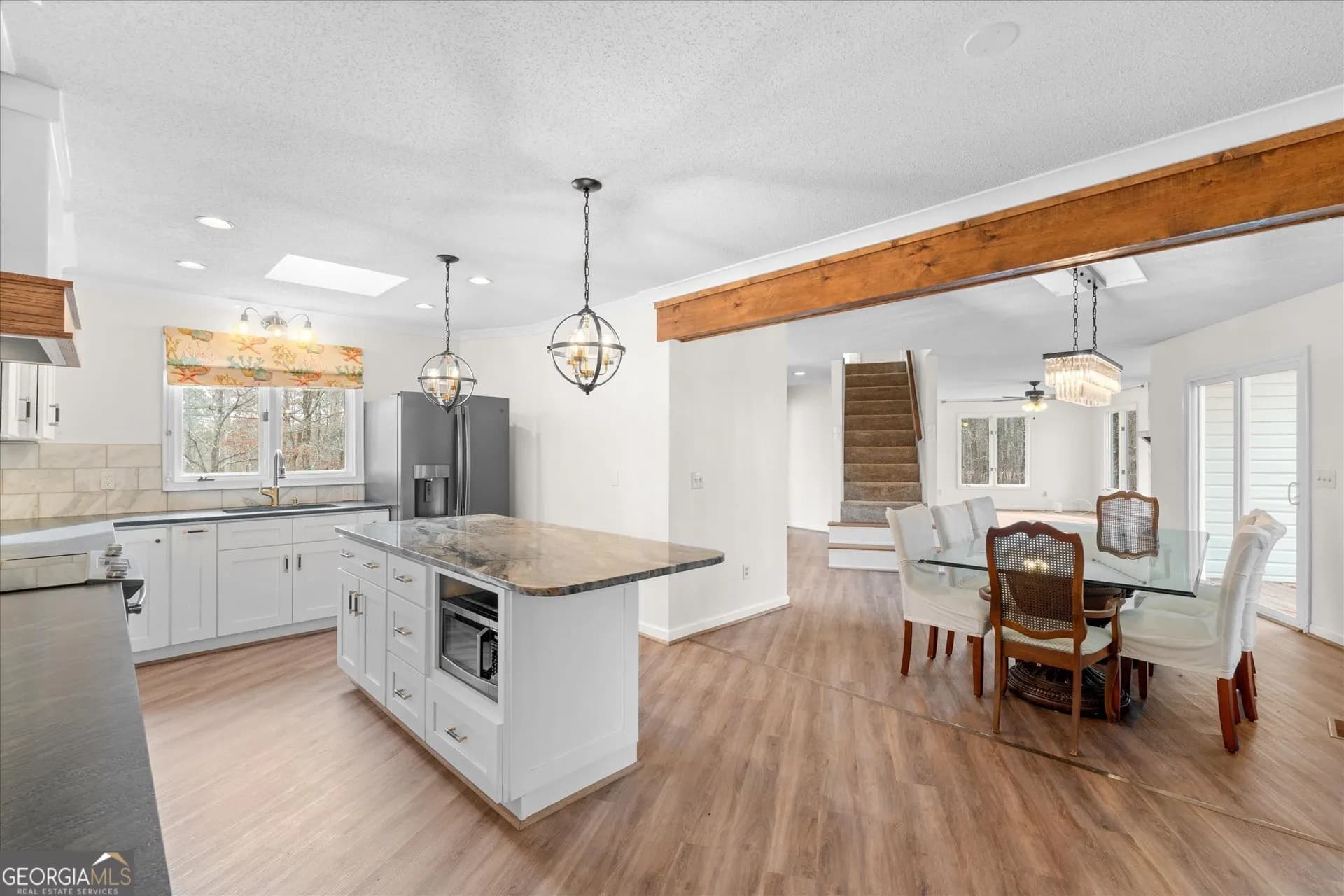 7349 S Mitchell Ct — photo 9 of 58