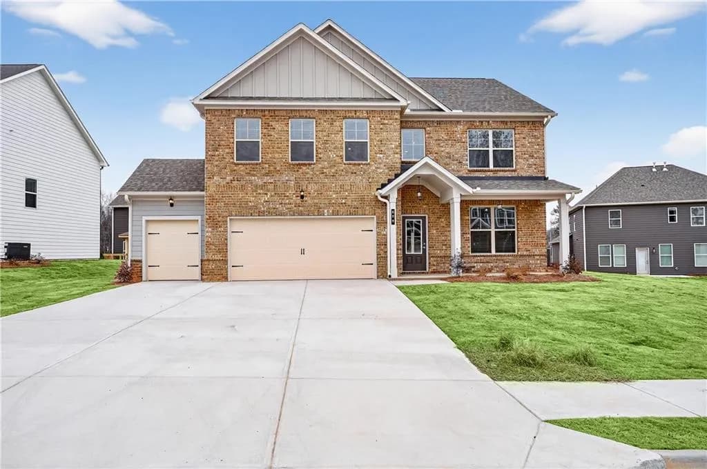 Craftsman house featuring a front lawn, brick siding, concrete driveway, a garage, and a shingled roof