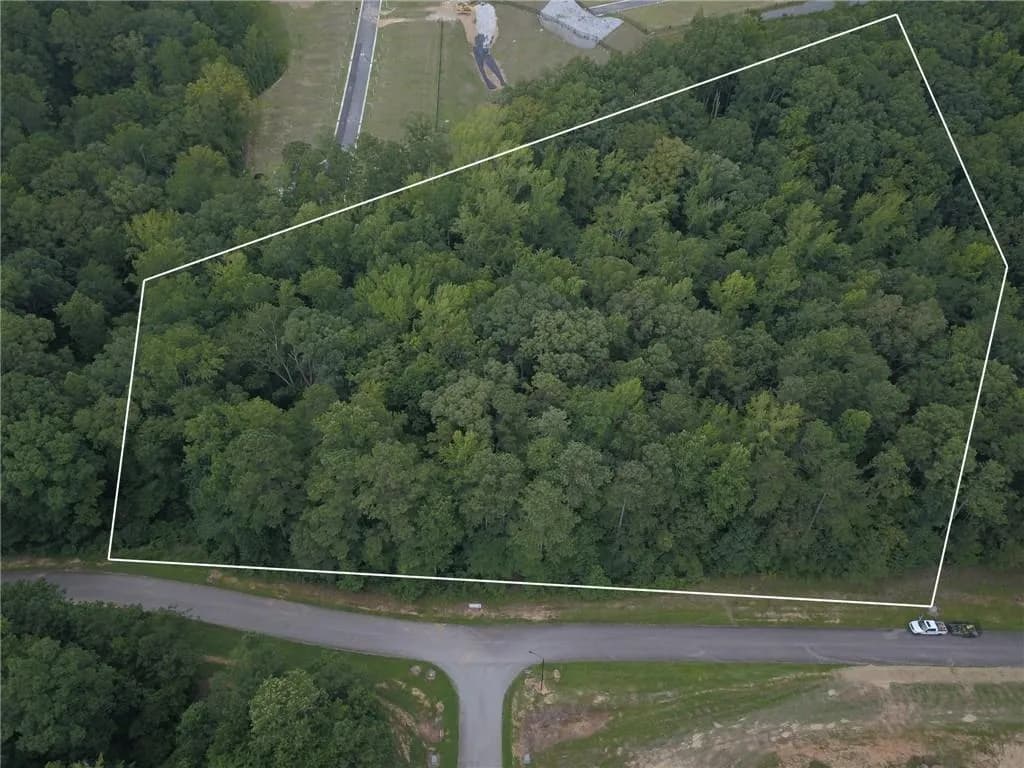 View of property location with a forest and property parcel outlined