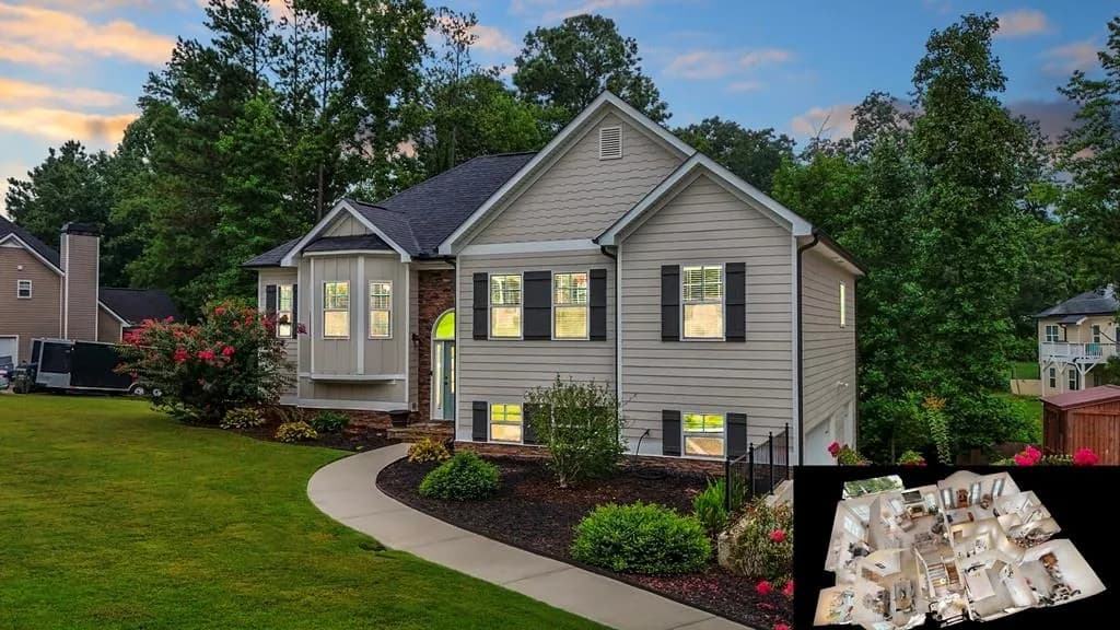 View of front of home featuring board and batten siding, a garage, view of wooded area, and roof with shingles