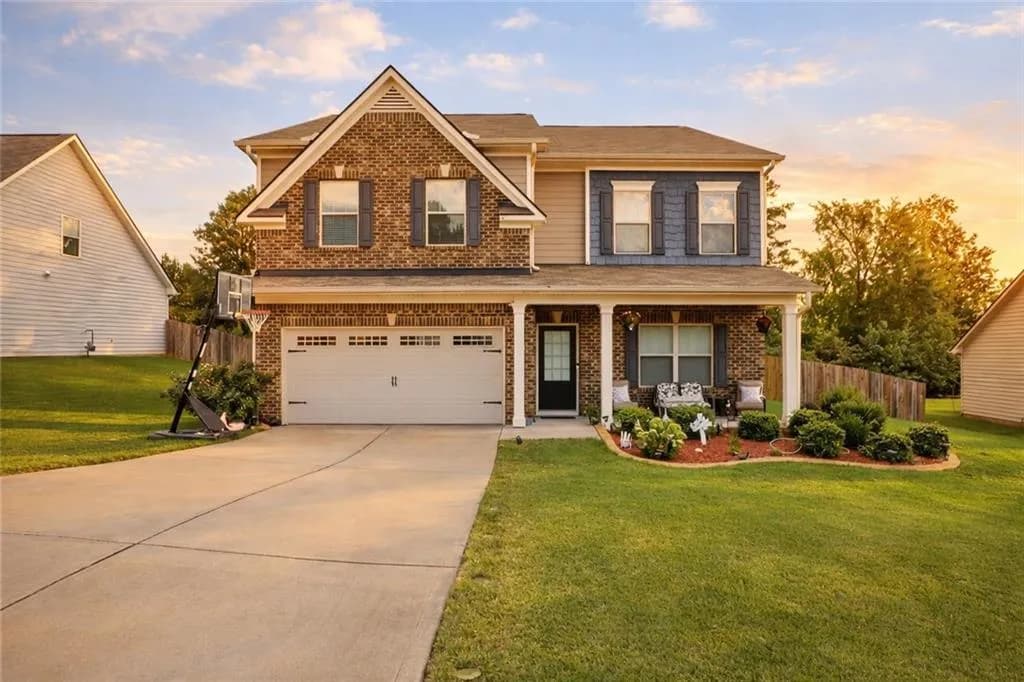 Craftsman inspired home featuring brick siding, covered porch, concrete driveway, and an attached garage