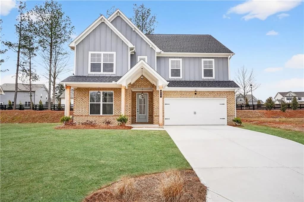 Contemporary two-story exterior with brick and board and batten siding