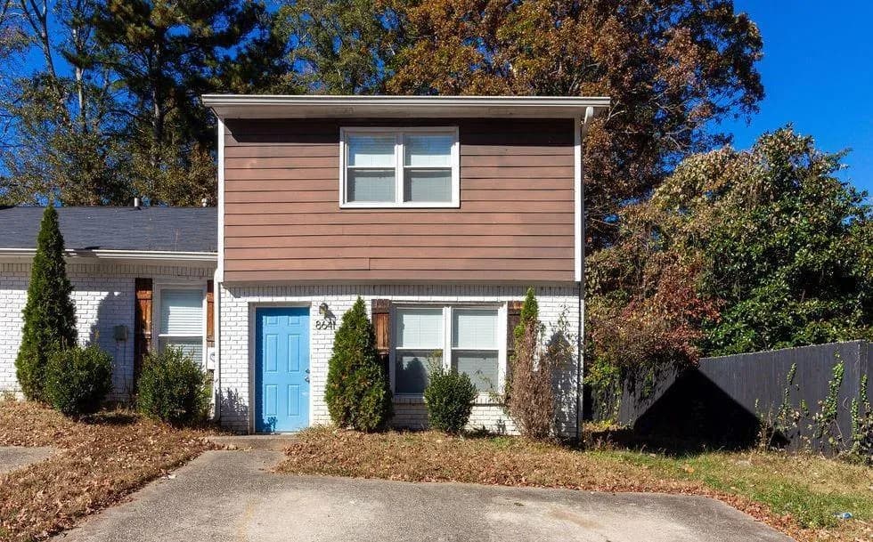 View of front of home featuring brick siding