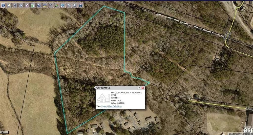 Aerial map of property and surrounding area featuring property boundaries highlighted