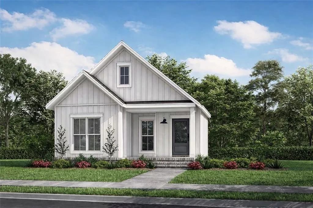 Modern farmhouse style home featuring board and batten siding, a front yard, and a porch