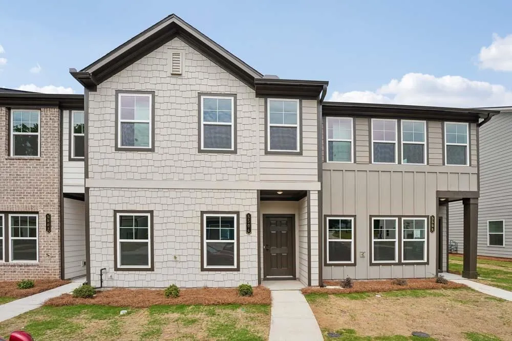 Front elevation showcasing classic brick siding, offering timeless elegance and a strong, enduring architectural presence.