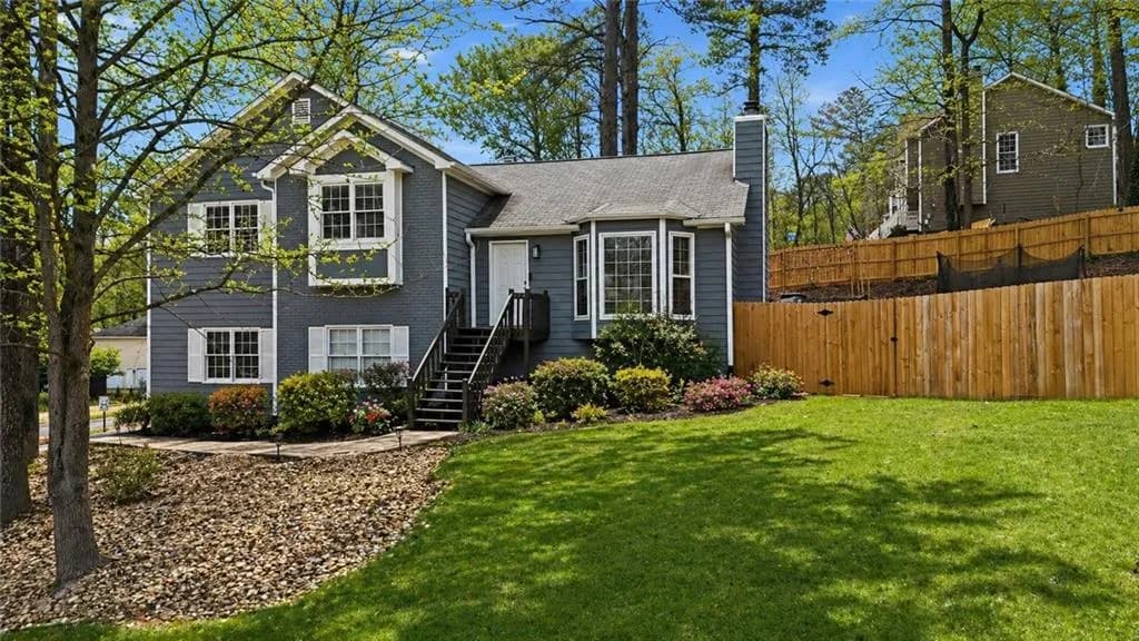 Virtually enhanced to showcase potential—landscaping, foliage, and lawn color have been digitally added for illustration purposes.