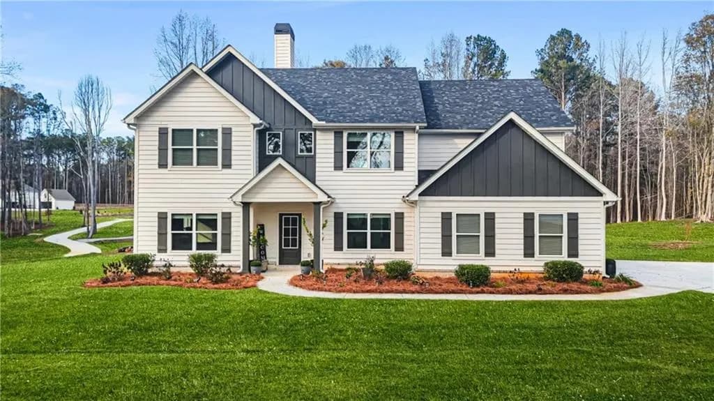 View of front of property featuring board and batten siding, a front lawn, a chimney, and roof with shingles